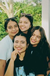 A group of cheerful teenagers smiling together in an outdoor setting in San Martín, Peru.