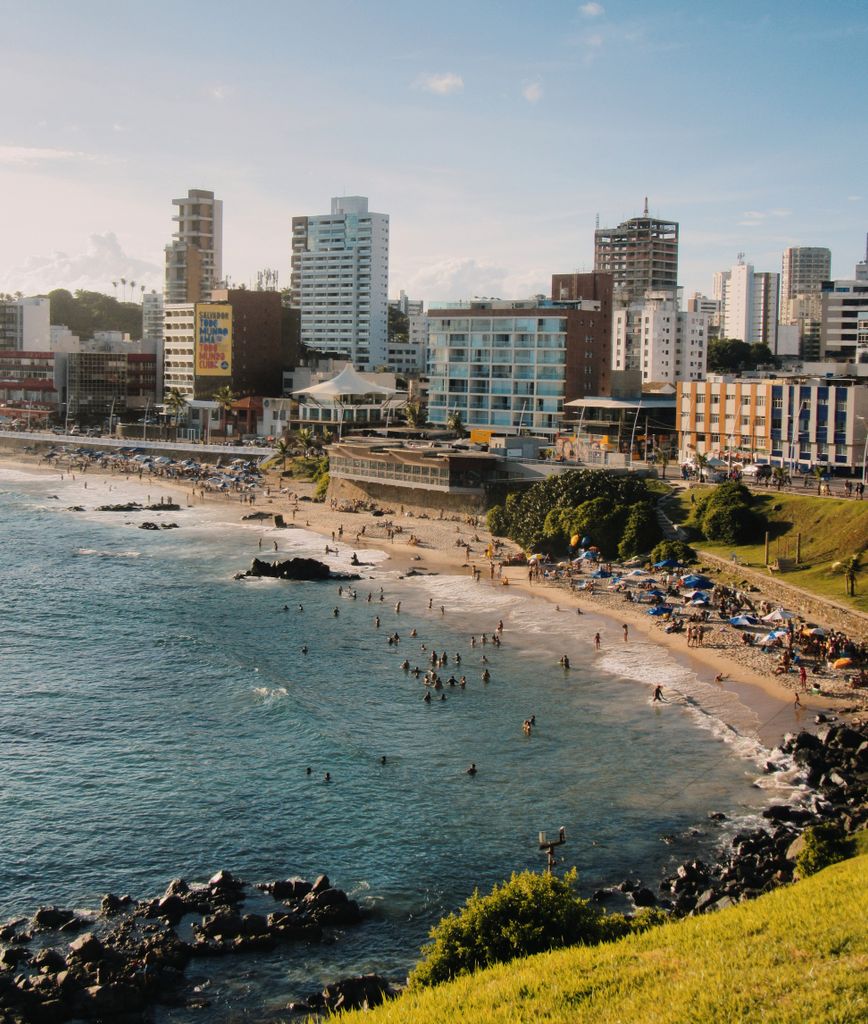 A vibrant aerial view of the bustling Salvador beachfront, capturing urban and natural beauty.